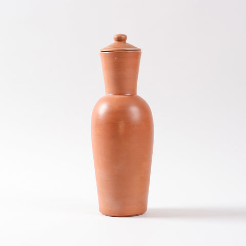 Front view of a terracotta water carafe and lid highlighting the natural clay finish and handcrafted earthenware design