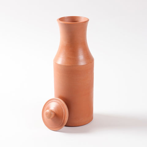 Terracotta water pitcher with matching clay lid displayed open on a plain background, showcasing its handcrafted earthenware design
