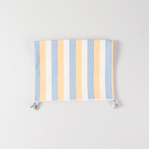 Folded handwoven cotton table runner highlighting striped design, tasselled edges, and handcrafted table linen quality