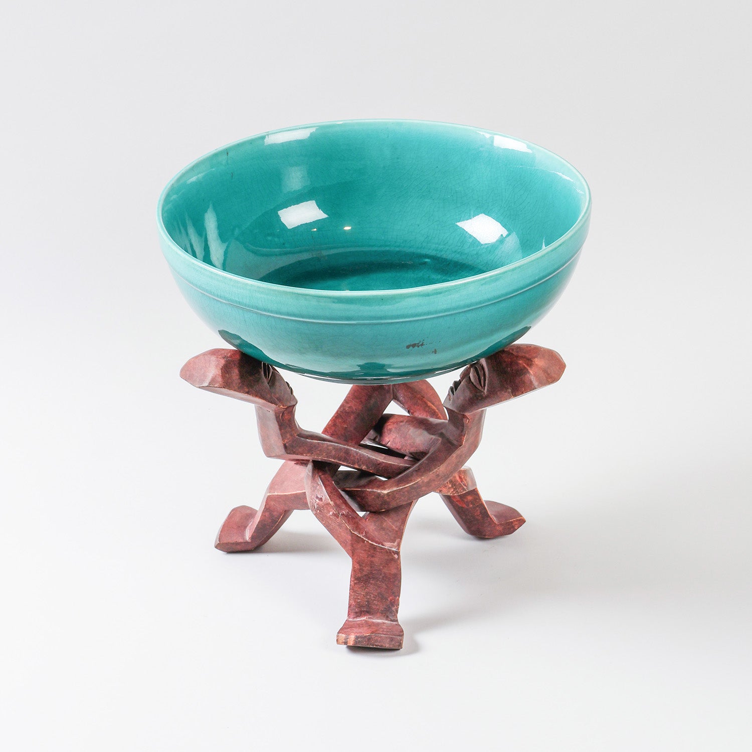 Handmade turquoise ceramic bowl with a hand-carved wooden stand, ideal as a serving bowl and decorative centrepiece
