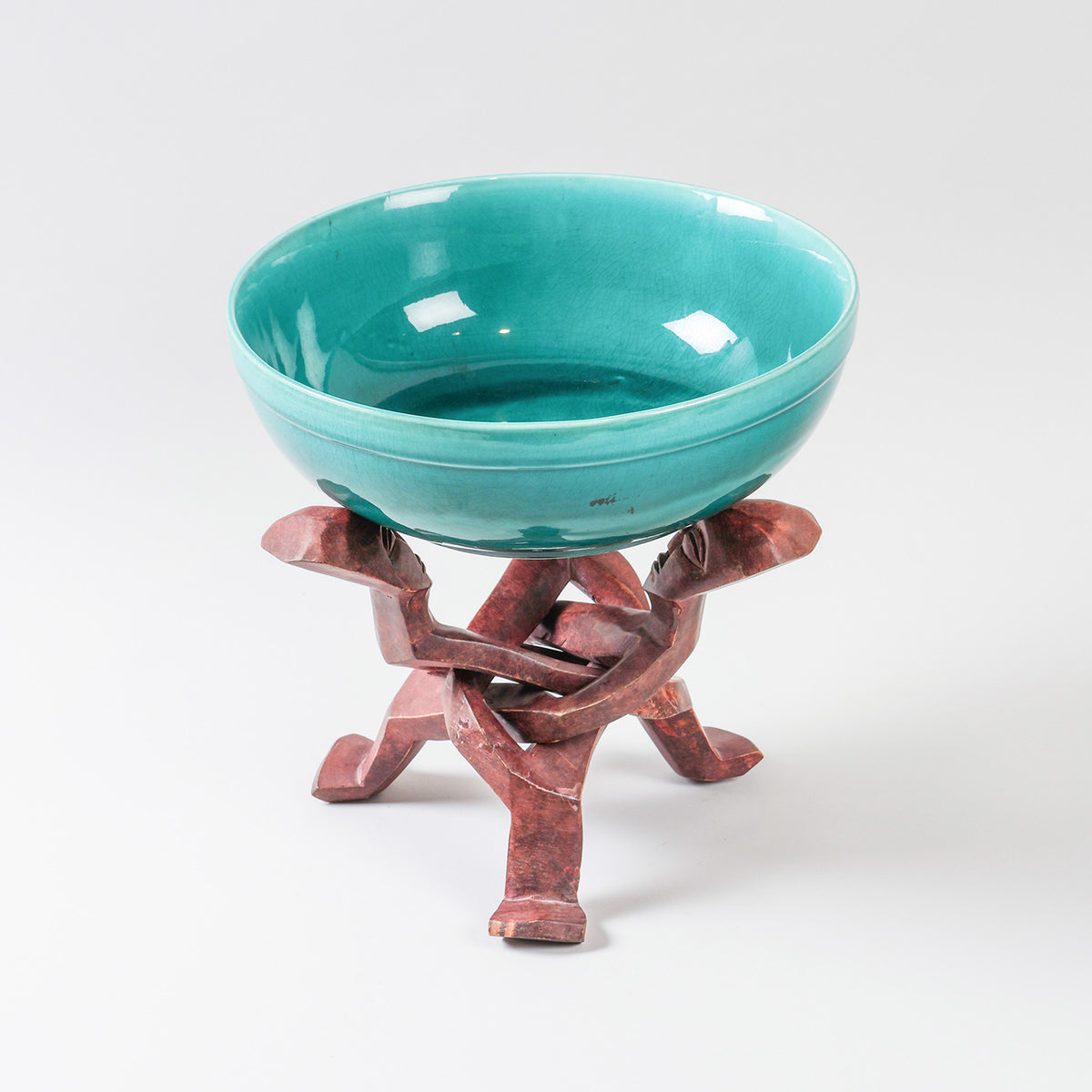 Handmade turquoise ceramic bowl with a hand-carved wooden stand, ideal as a serving bowl and decorative centrepiece