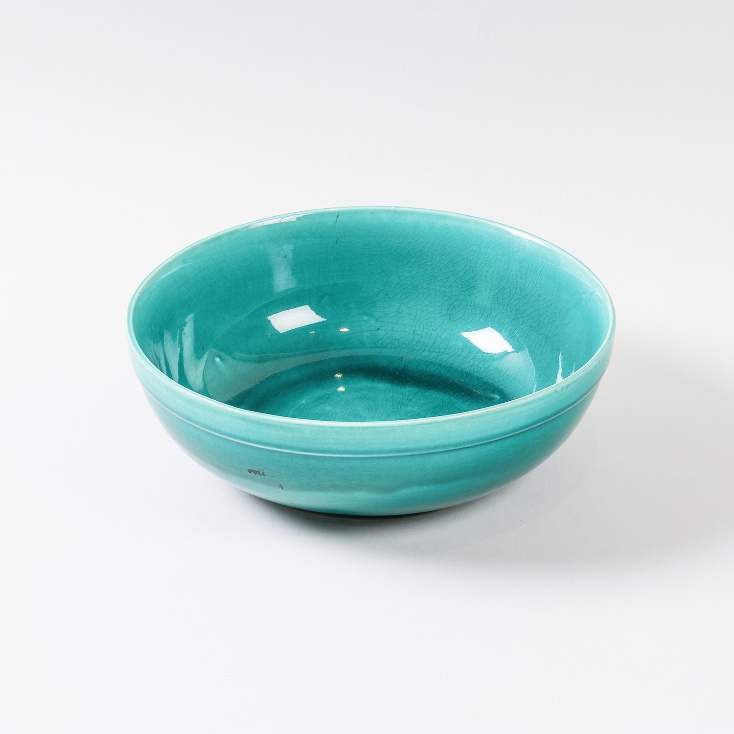 Hand-painted turquoise ceramic serving bowl with a glossy finish, handcrafted in Ghana and suitable for fruits, snacks, and dining use