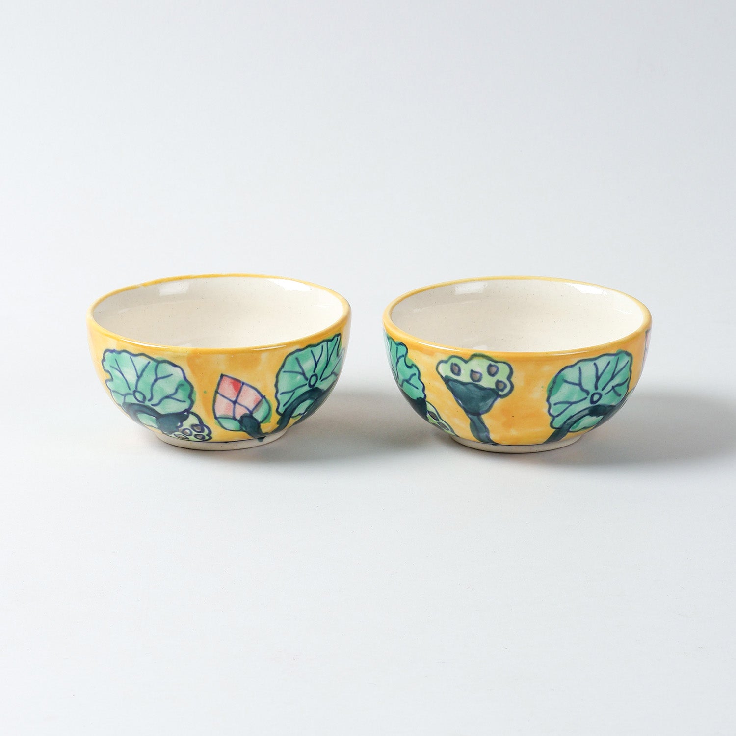 Hand-painted Water Lily ceramic katori set of 2 placed side by side on a plain background, featuring vibrant floral motifs inspired by water lilies and Khurja ceramics