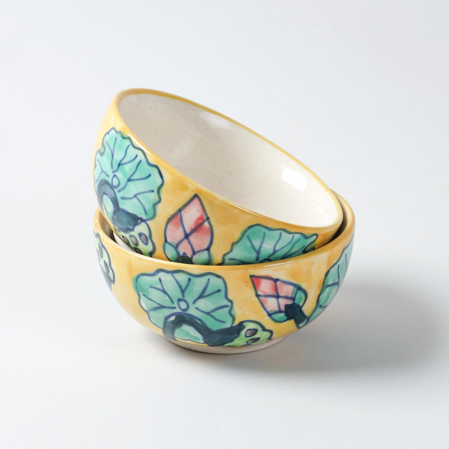 Handmade Water Lily ceramic portion bowls arranged in a stacked display on a plain background, featuring colourful floral motifs and glossy finish