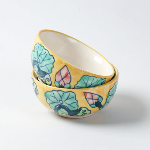 Handmade Water Lily ceramic portion bowls arranged in a stacked display on a plain background, featuring colourful floral motifs and glossy finish