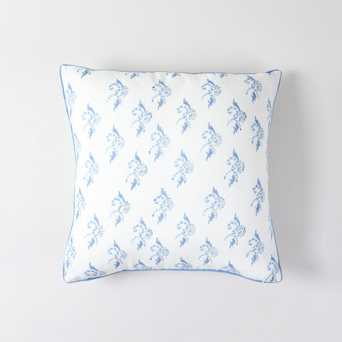 Decorative cotton linen pillow cover featuring blue swirl artwork and elegant piped border
