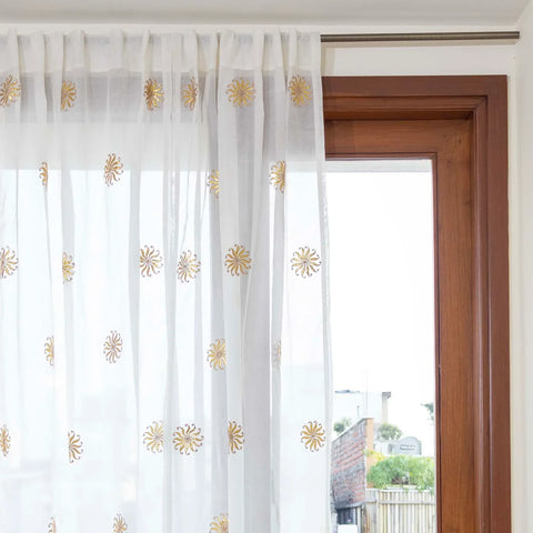 Handwoven white Chanderi curtain styled as a balcony curtain, creating a soft and sophisticated look
