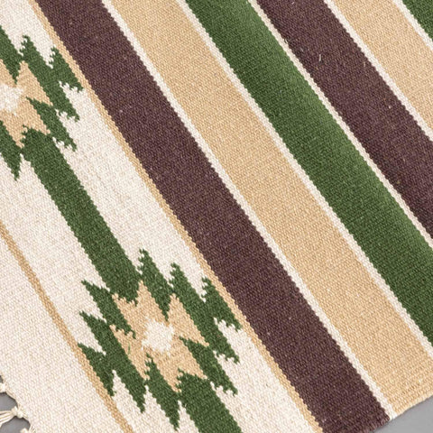Close-up of handwoven cotton rug highlighting intricate weave texture and white green pattern detailing
