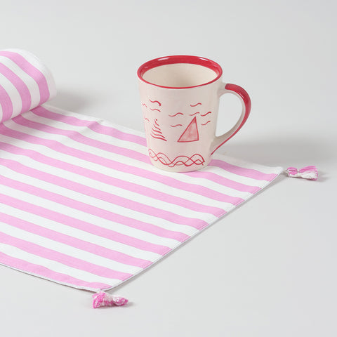 White and pink striped handwoven cotton table runner displayed as a cheerful handmade home décor accent