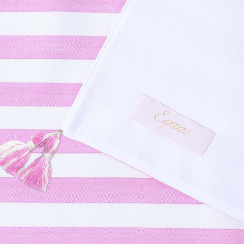 Front and back view of handwoven cotton table runner highlighting striped design, tasselled edges, and handcrafted table linen quality
