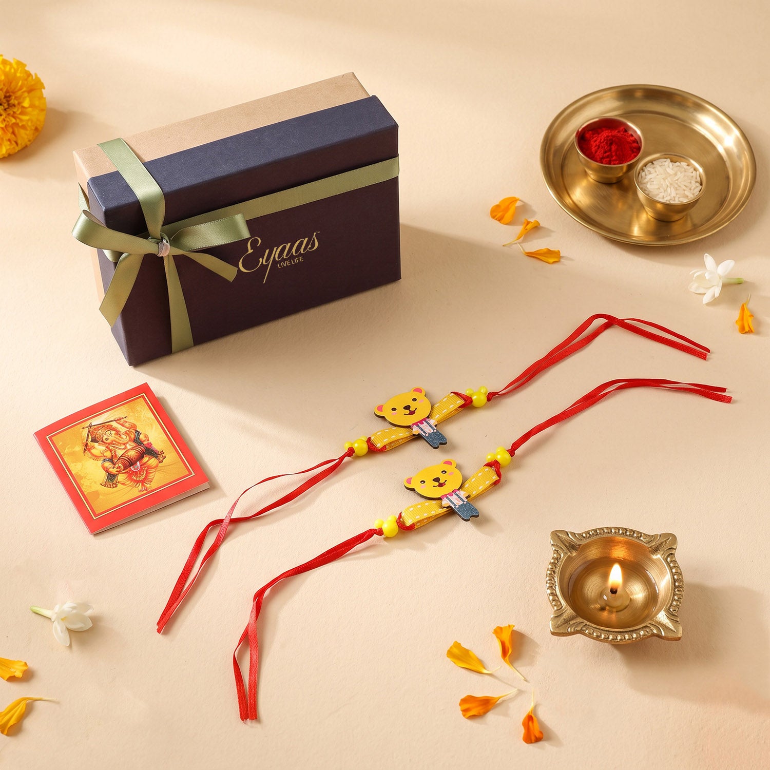 Handcrafted Wooden Teddy Bear Kids Rakhi Set of 2. Cartoon rakhi for brothers, beautifully presented in a festive gift box with red satin ribbon, ready for Raksha Bandhan gifting.