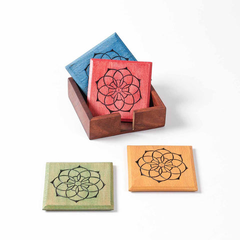 Handmade wooden coaster set crafted in India with colourful mandala patterns for everyday table use
