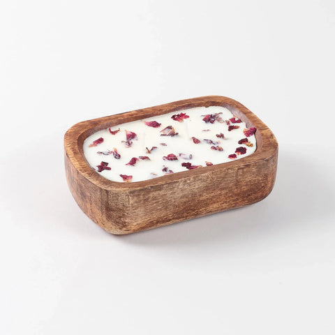 Angled view of a handcrafted wooden tub soy wax candle with rose fragrance