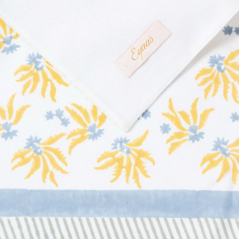 Hand block printed cotton placemat showing front and reverse sides with Eyaas brand label detail