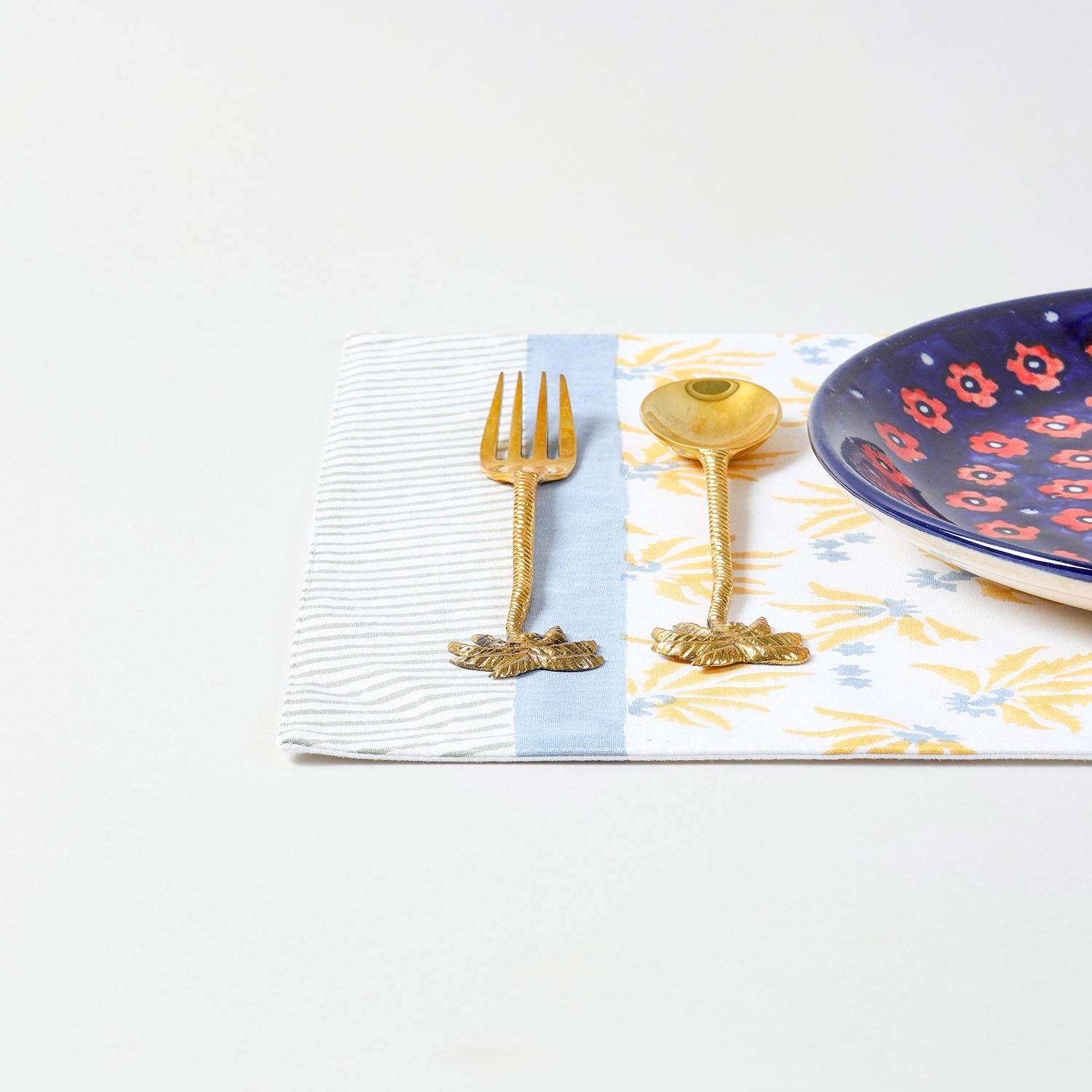 Single floral cotton placemat styled for dining table decor with handcrafted block printed design