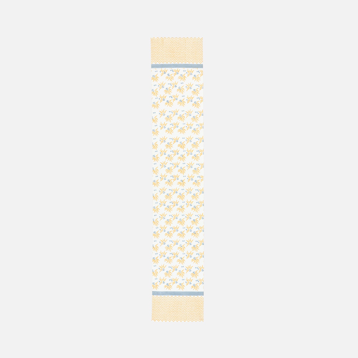 Full length table runner with yellow and blue floral motifs arranged in a diagonal pattern
