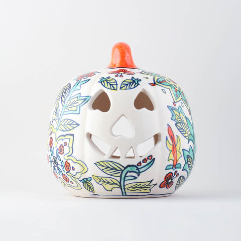 Hand-painted yellow floral ceramic pumpkin tea light holder with decorative cutwork handcrafted in Khurja