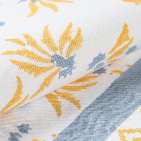 Intricate floral block printing, fabric weave, and handcrafted textile details
