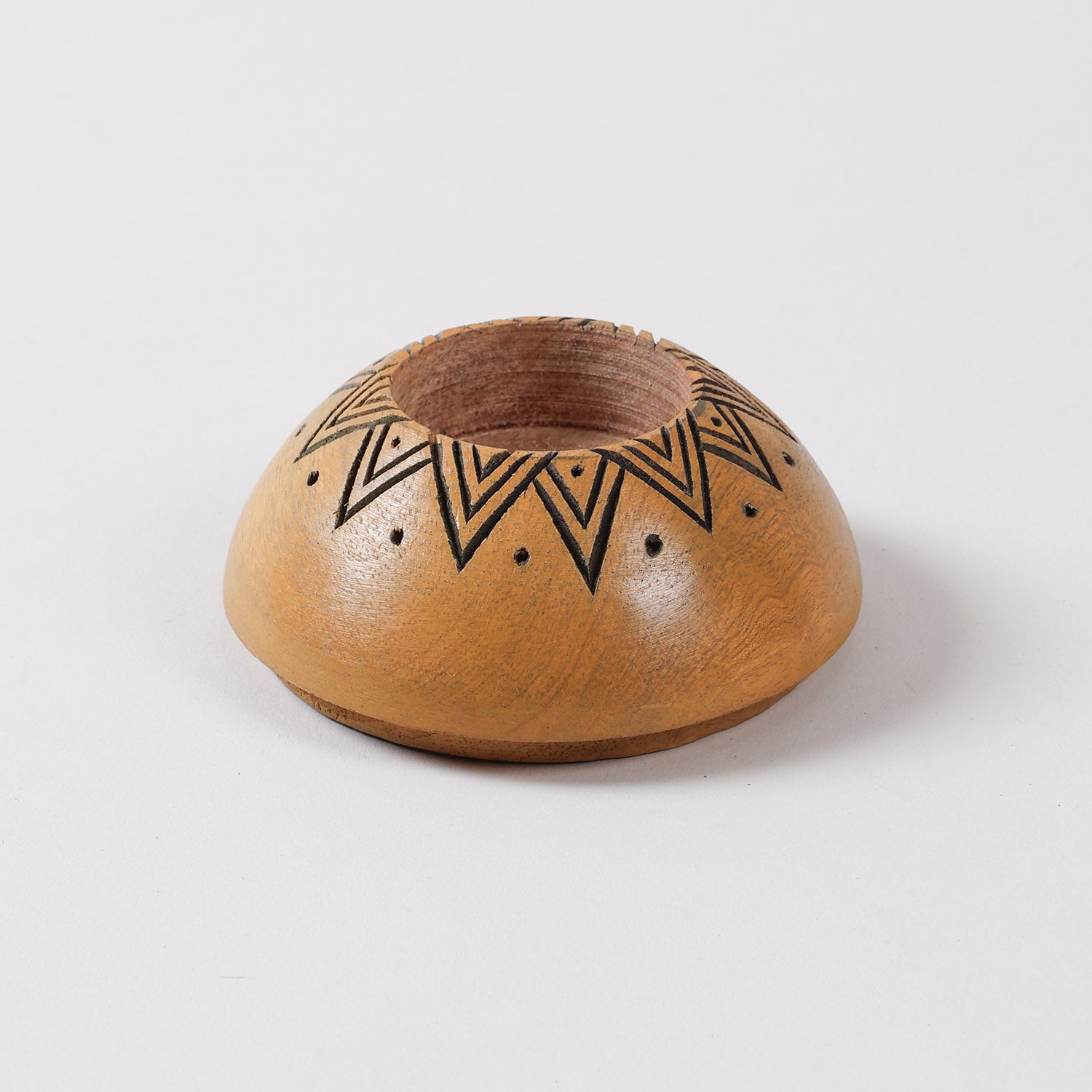 Yellow wooden T-light holder with a carved sun motif, handcrafted for Diwali decor, home decor, and decorative candle arrangements