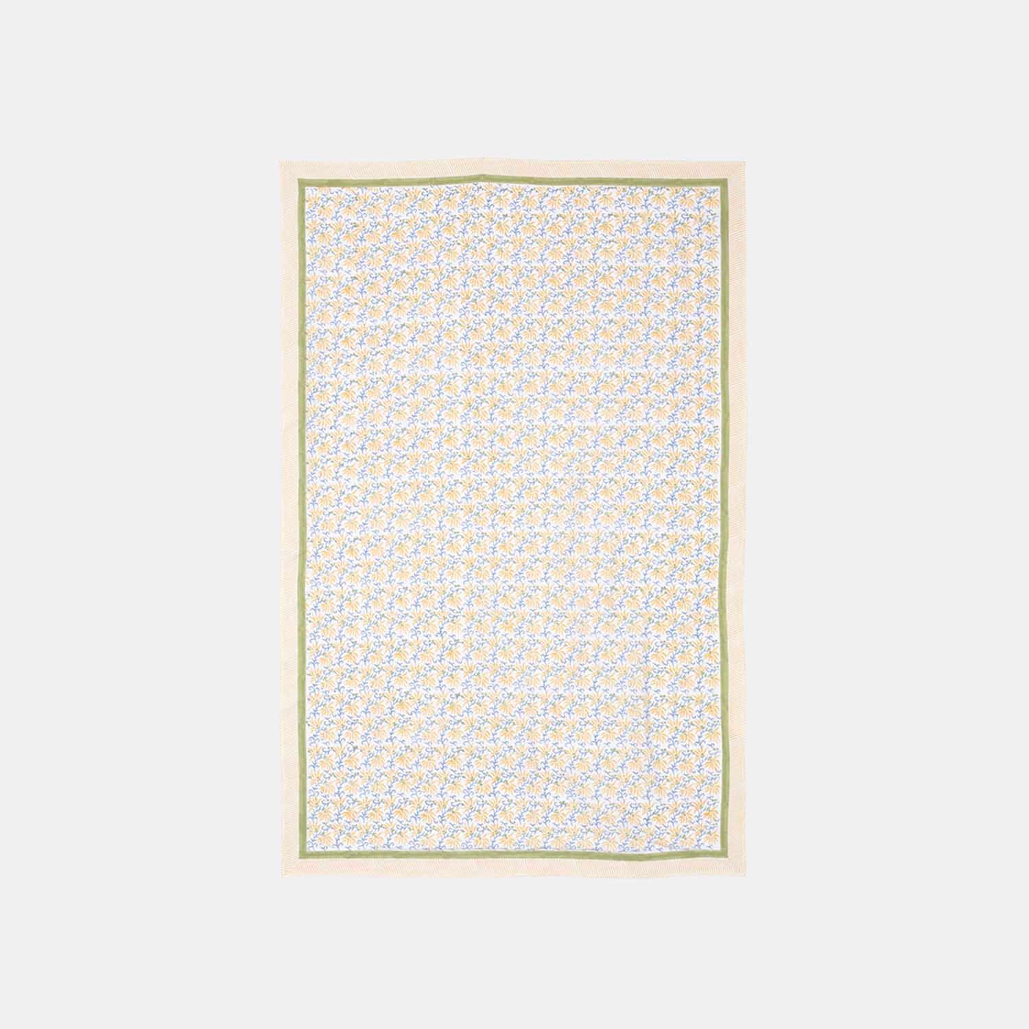 Yellow lily floral hand block printed cotton table cloth featuring yellow blossoms and blue vine motifs on a white base