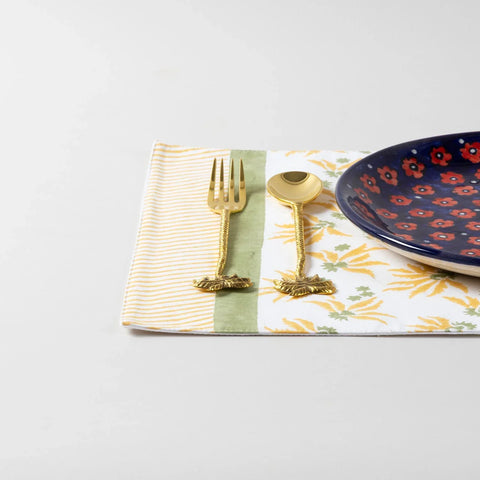 Single yellow lily block printed placemat styled with tableware for dining table decor and everyday meals