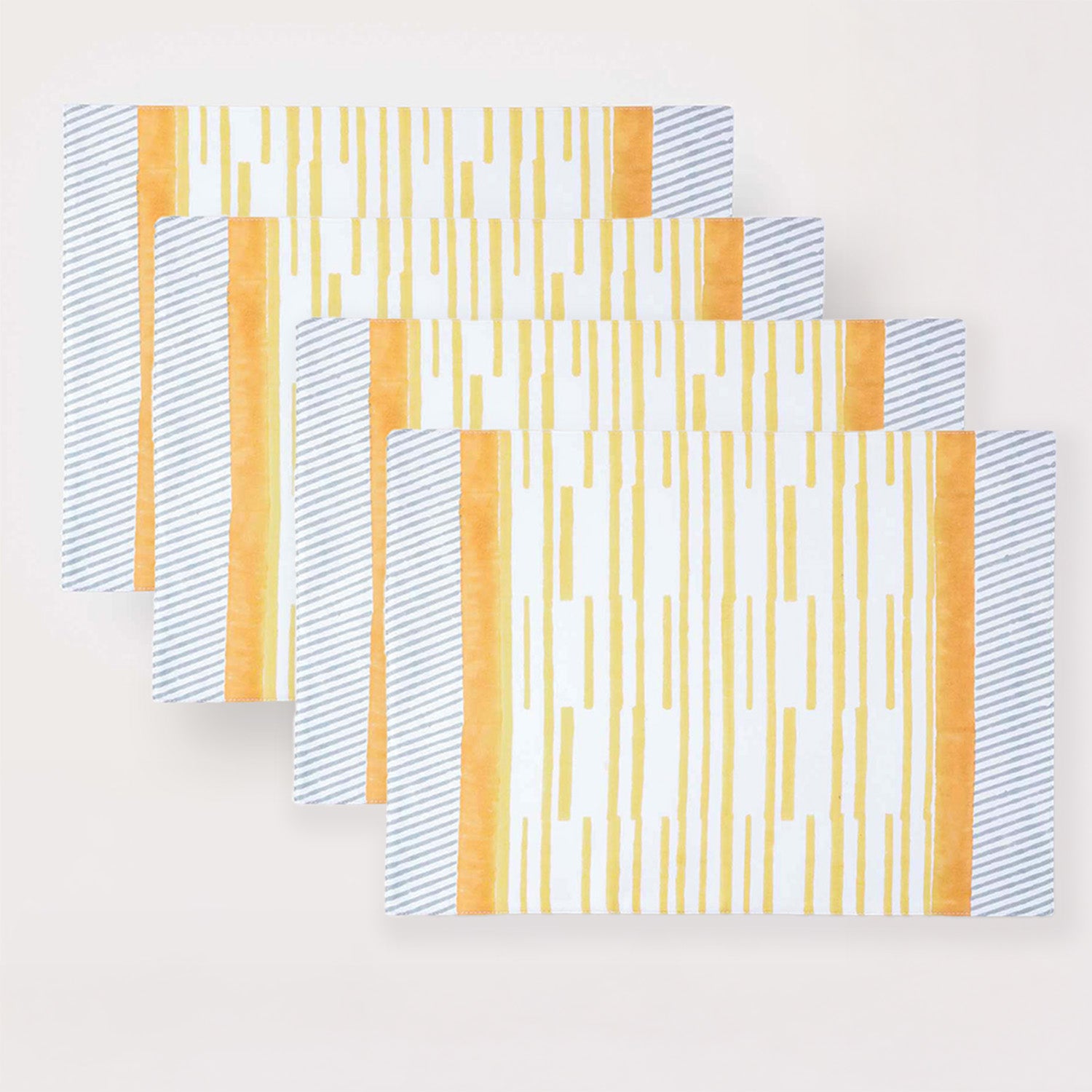 Set of four hand block printed placemats with yellow stripe pattern for family dining occasions