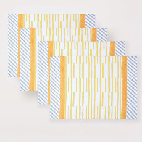 Set of four hand block printed placemats with yellow stripe pattern for family dining occasions
