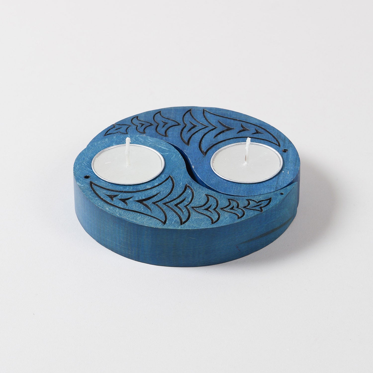 Blue wooden T-light holders set of 2 featuring hand carved bird motifs and Ying Yang design, displayed on a plain background without candles