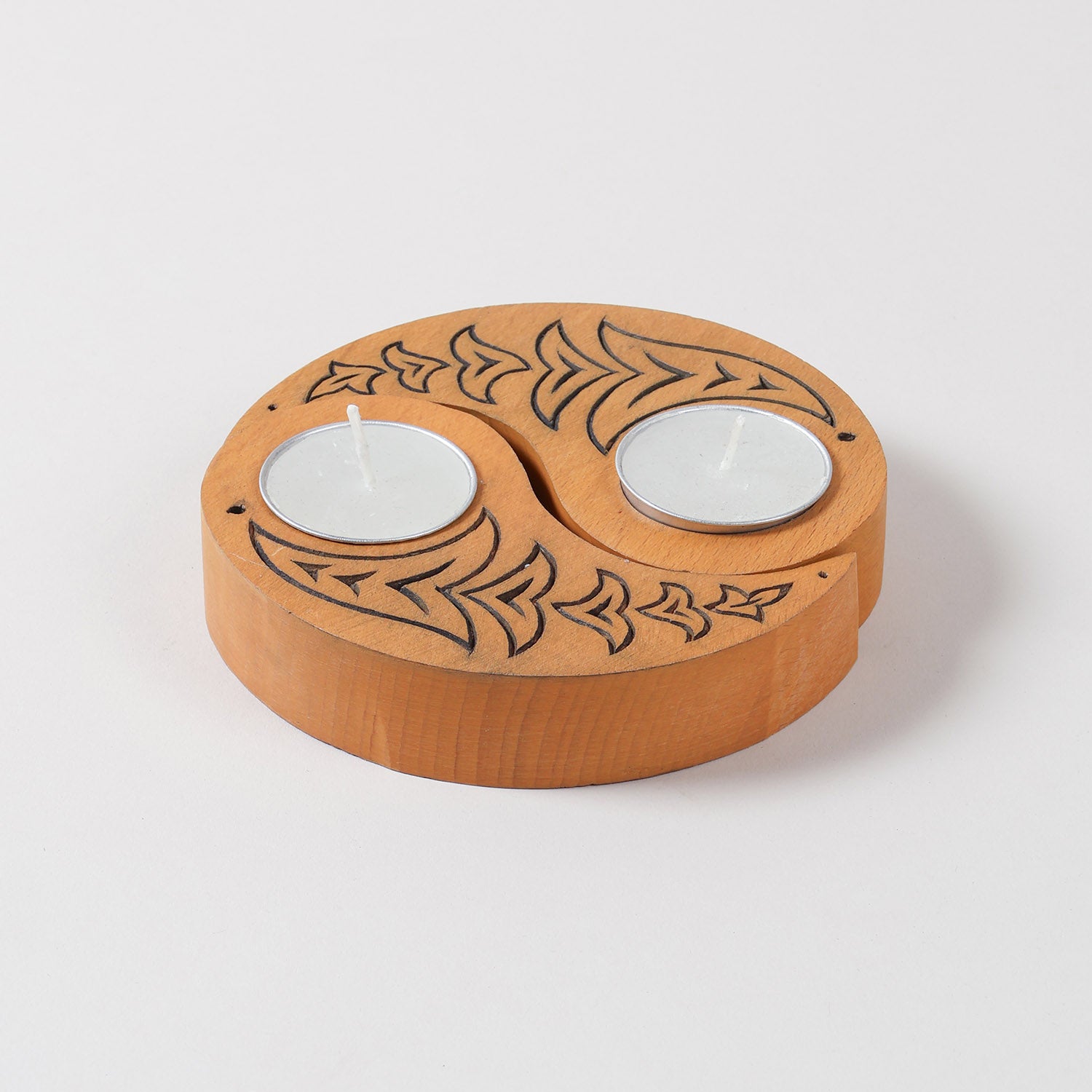 Yellow wooden T-light holders set of 2 featuring hand carved bird motifs and Ying Yang design, displayed on a plain background without candles