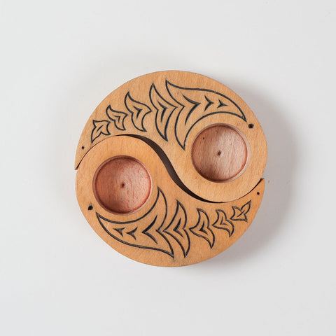  Top view of hand carved wooden T-light candle holders in a Ying Yang bird design, showcasing detailed craftsmanship and decorative appeal