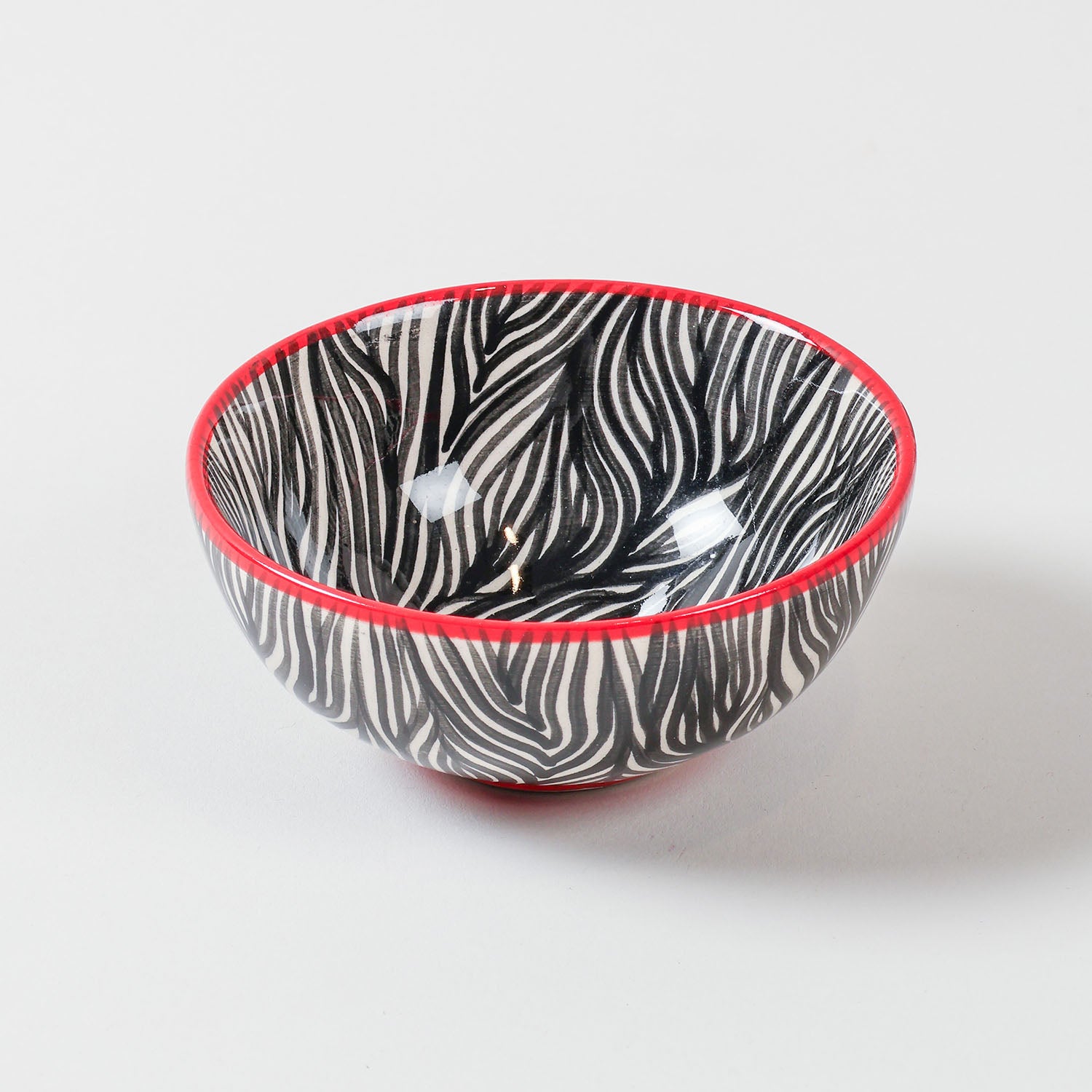 Handpainted ceramic bowl with a zebra pattern design in black and white, perfect as a small bowl for snacks, desserts, sides, and everyday dining
