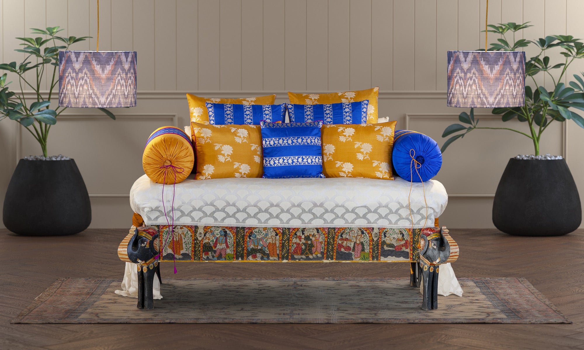 Blue handwoven Banarasi brocade bolster styled on a sofa for elegant home décor.