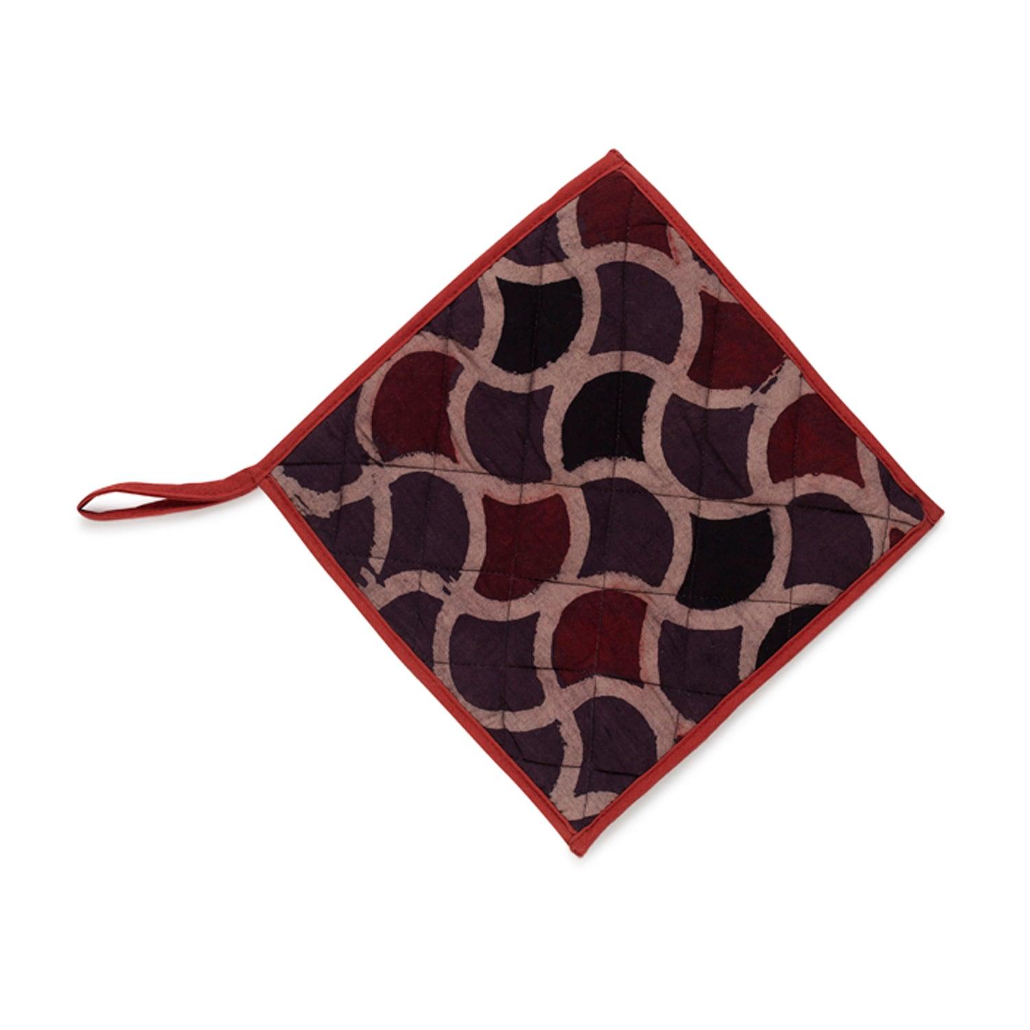 Single Ajrakh hand block-printed cotton pot holders featuring a fish scale pattern in brown and madder red.